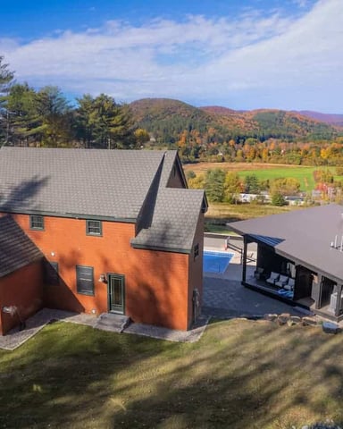 Dining table at a seasonal-rental home in Vermont with panoramic views of the Green Mountains.