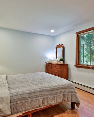 Bedroom with Killington mountain poster on the wall