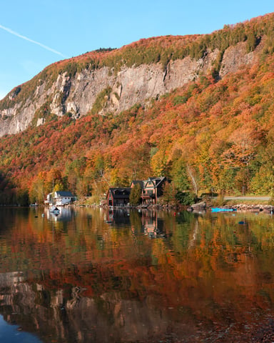 Family walking through Vermont fall foliage